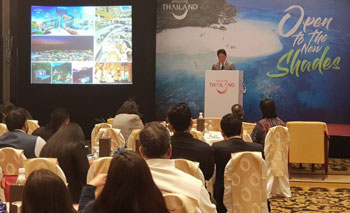 TAT Deputy Governor for Marketing Communications Tanes Petsuwan giving a product presentation